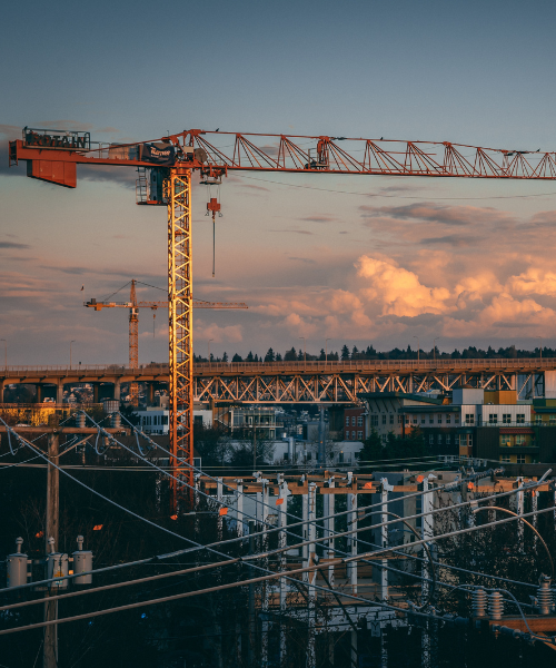 Civil engineering construction site with active groundwork and structural works.